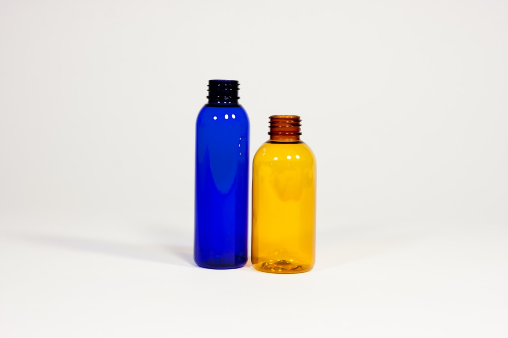 Small blue and yellow blow molded plastic bottles.